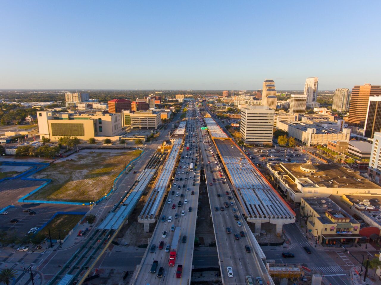 Aerial view of Interstate Highway 4 I-4 in Downtown Orlando with Central Business District skyline at sunset, city of Orlando, Florida FL, USA.