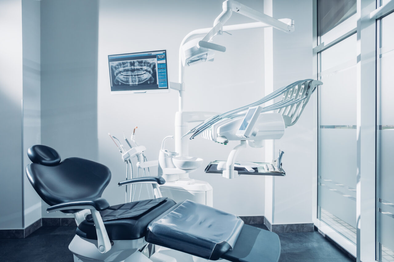 Dental office with dental chair, computer and dentist tools