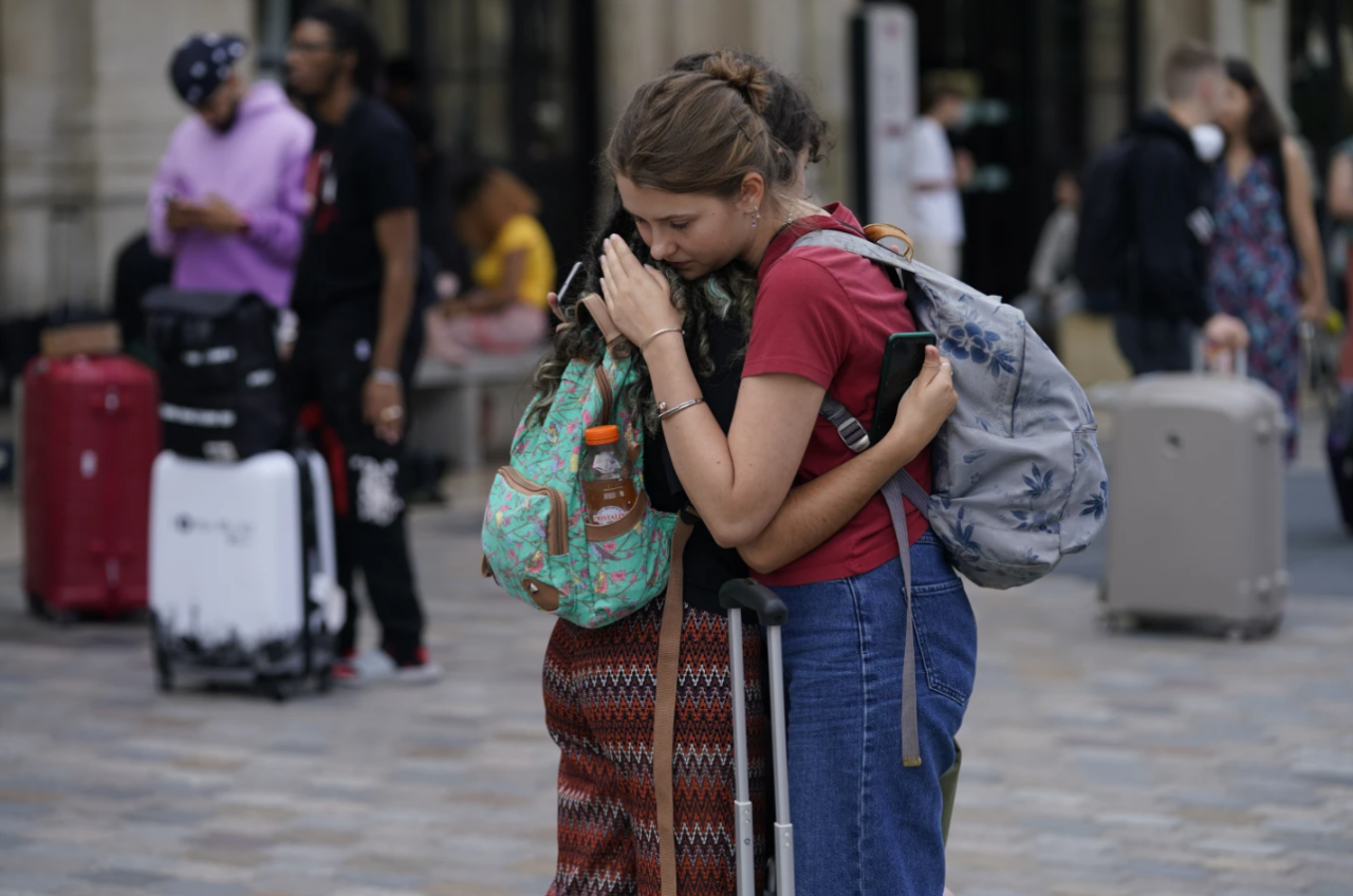 Women hugging France French train station