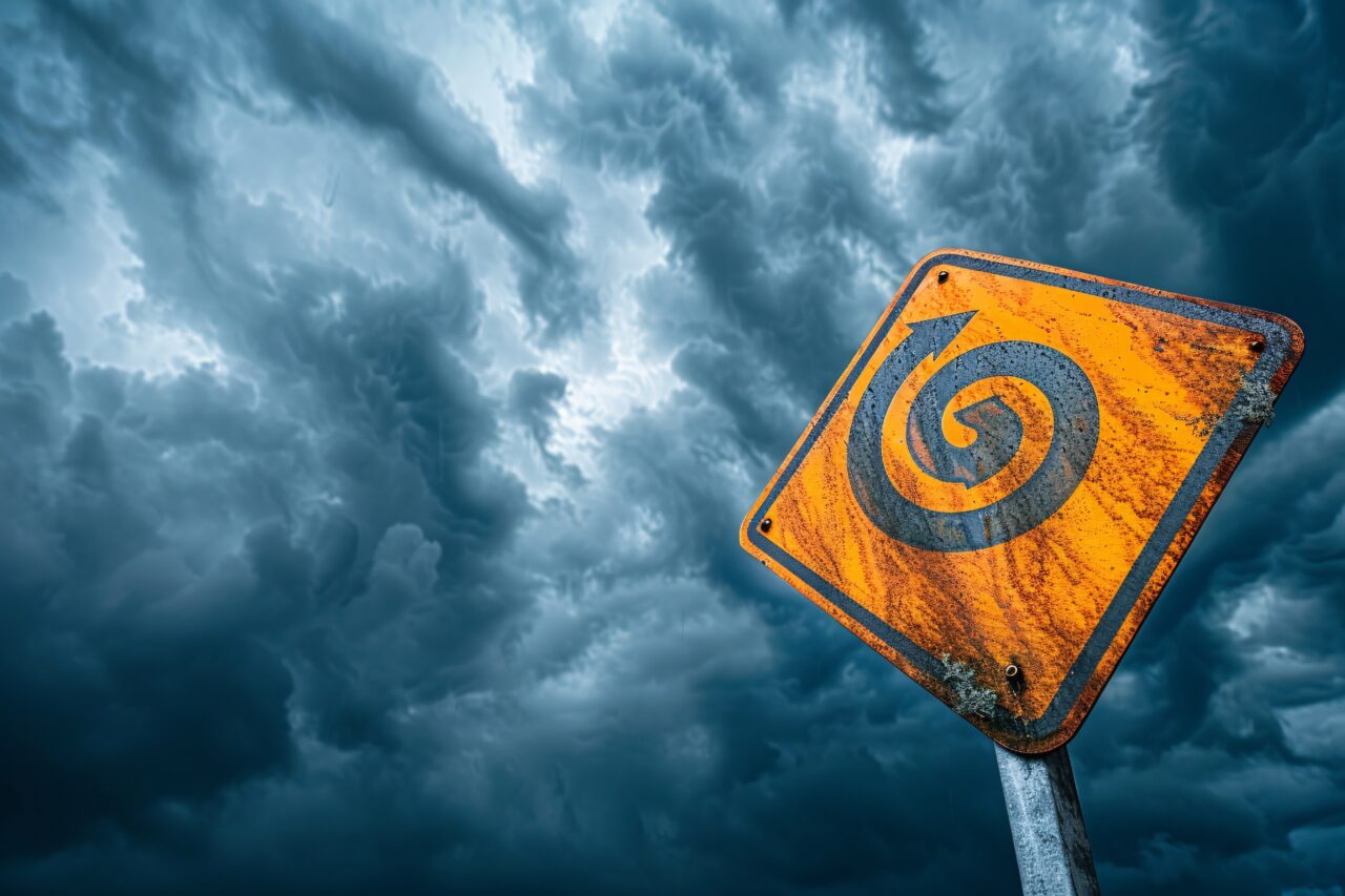 The stormy hurricane season is marked by a striking symbol against a dramatic cloudy backdrop.
