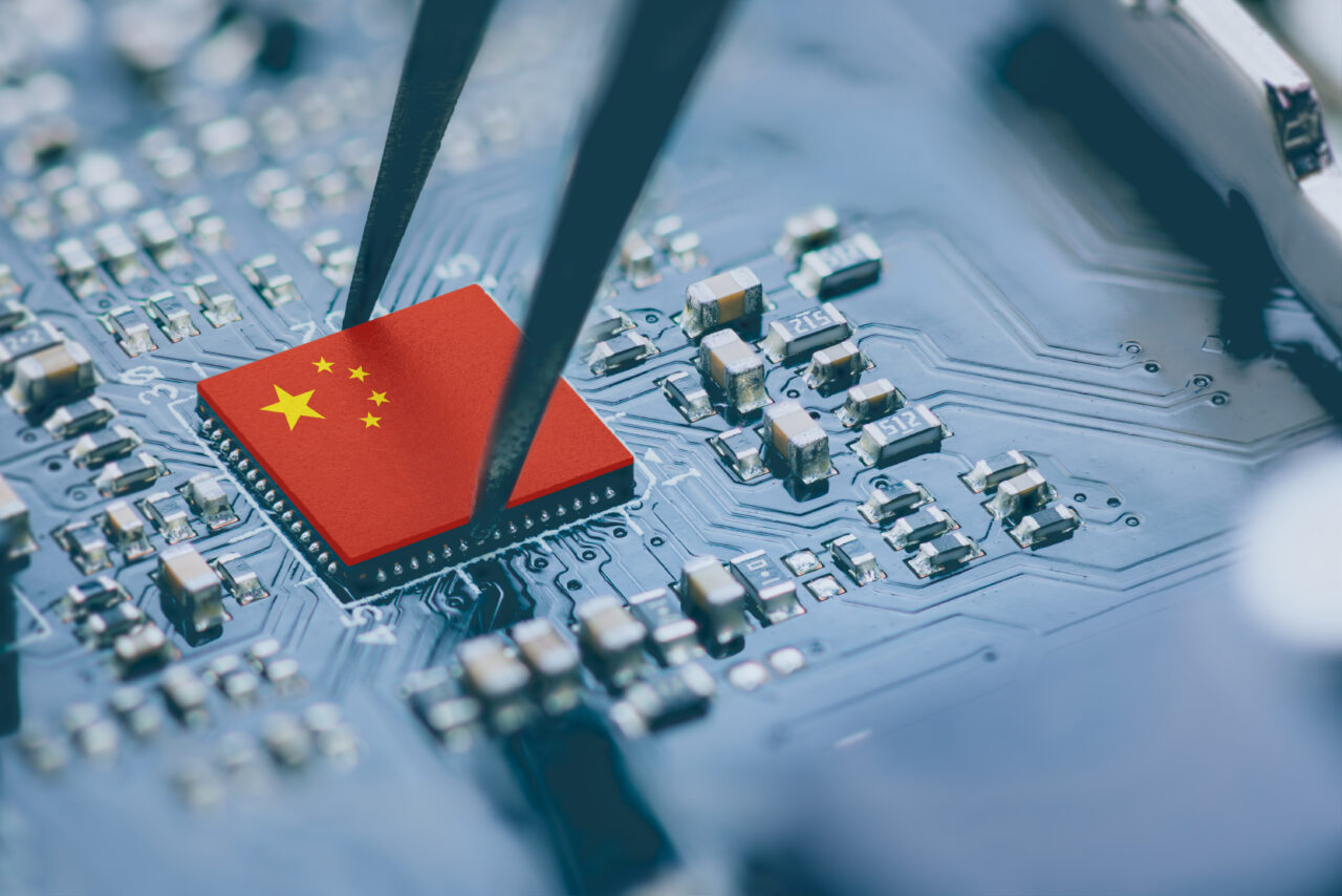 Flag of China on a processor, CPU Central processing Unit or GPU microchip on a motherboard. China is world's largest chip manufacturer, demonstrating the country's superiority in global supply chain.