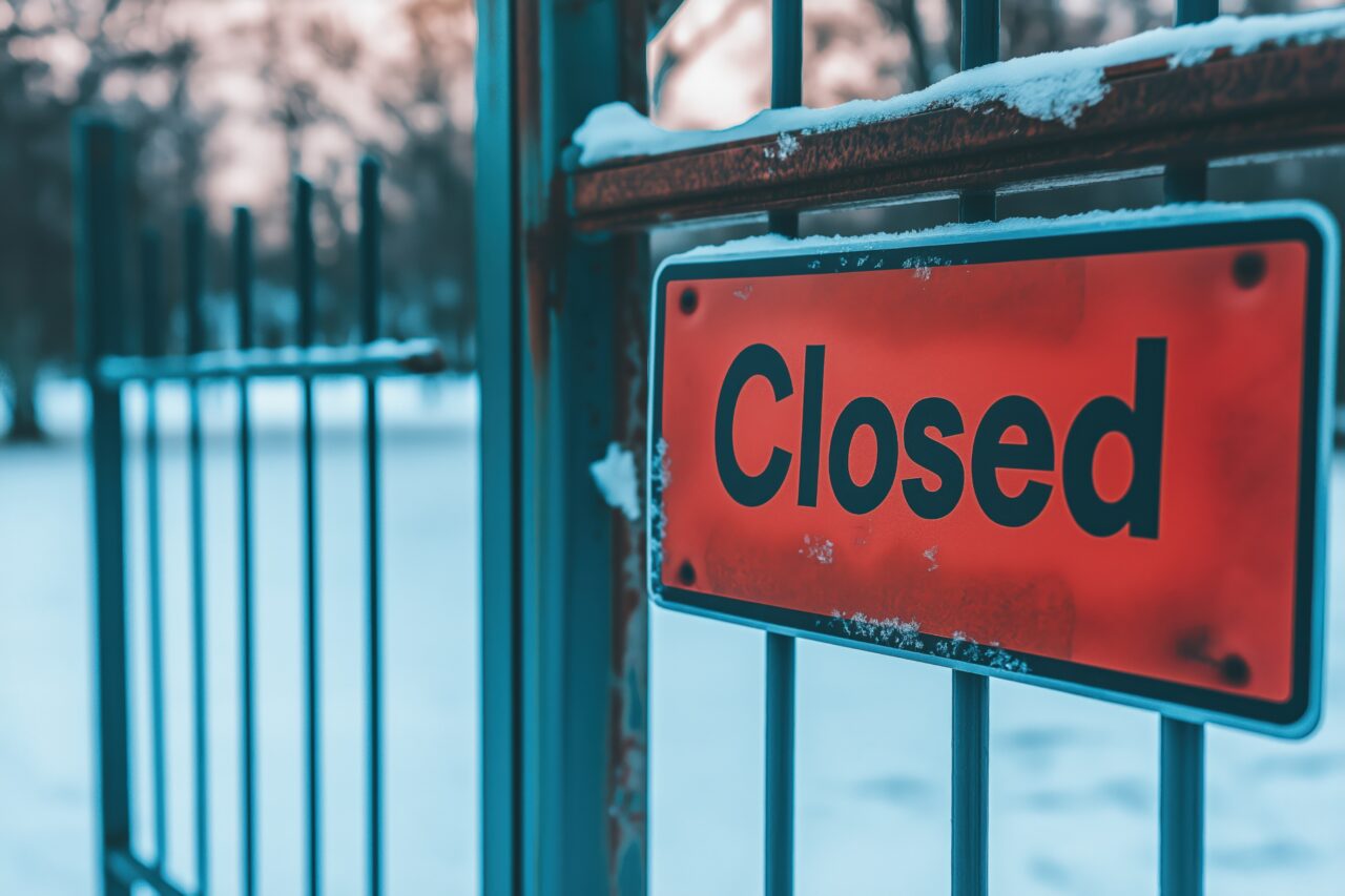 School playground remains empty due to extreme weather and closure sign hangs on the gate