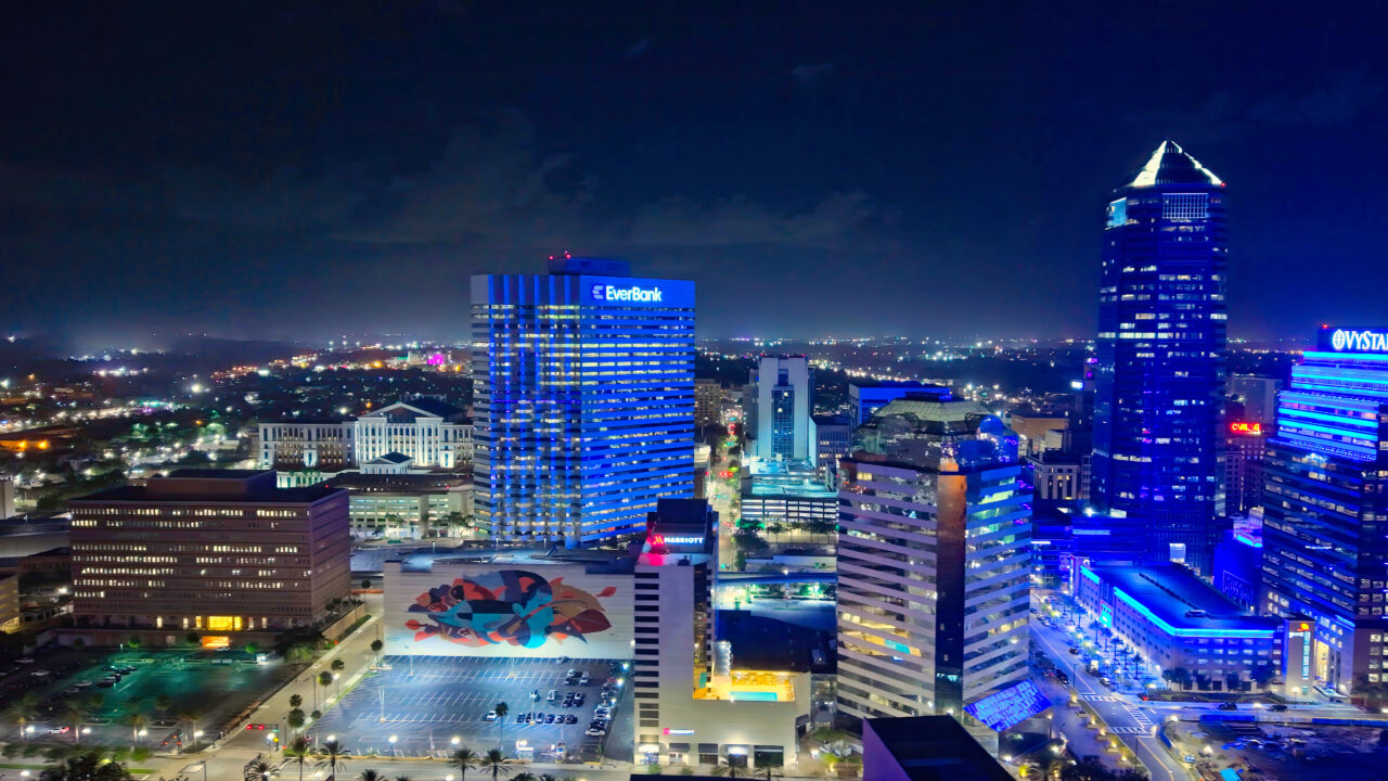 Jacksonville Florida Downtown skyline by night with iconic Everbank and Vystar buildings - JACKSONVILLE, FLORIDA - OCTOBER 30, 2024