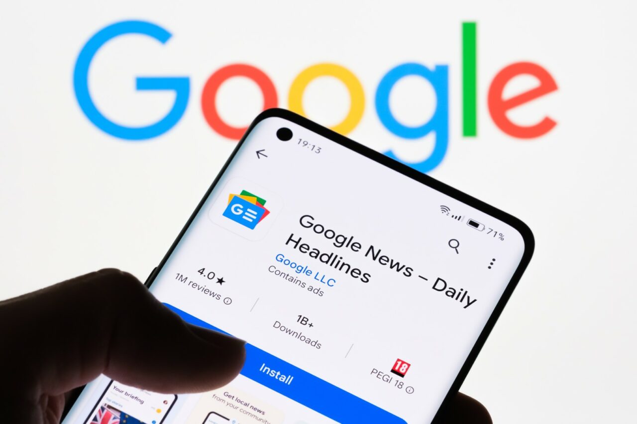 Close-up of a smartphone screen displaying Google News - Daily Headlines app with Google logo in the background, the connection between Google News and Google, Stafford, United Kingdom, August 8, 2024